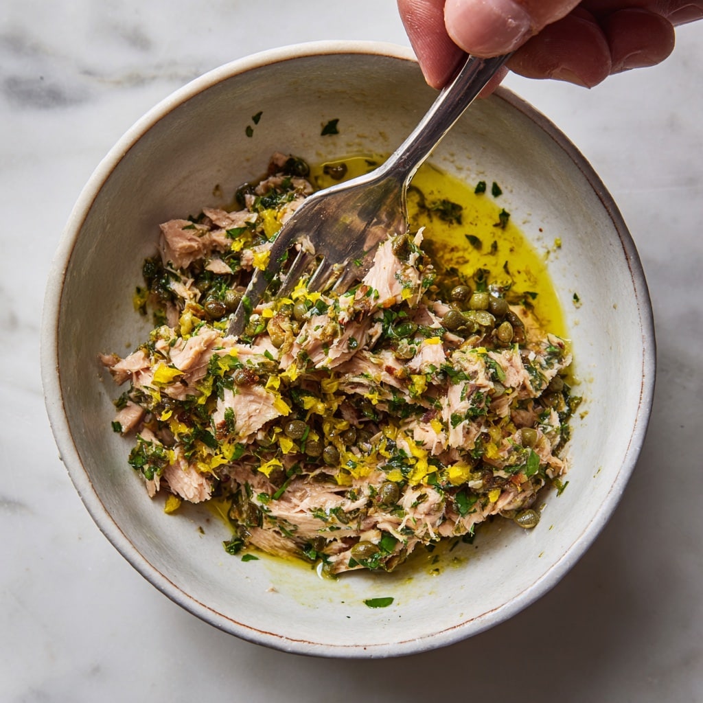 Buona Beef Tuna Genovese Copycat Recipe (Tastes Just Like the Real One) 9 Mixing Tuna Genovese sandwich filling in bowl